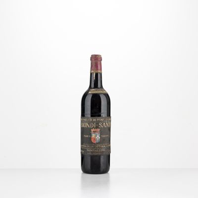 a bottle of wine sitting on top of a white table