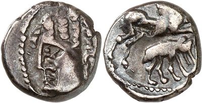 a silver coin with an image of a horse and a bird on it