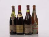 three bottles of wine are lined up on a table
