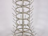 an image of a metal wine rack on a white background