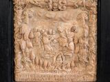 an image of a relief of a group of people in a garden