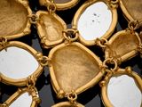 an image of a close up of a necklace on a black surface