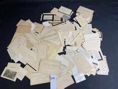 a pile of old papers on a black table