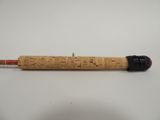 a close up of a wooden pen on a white surface