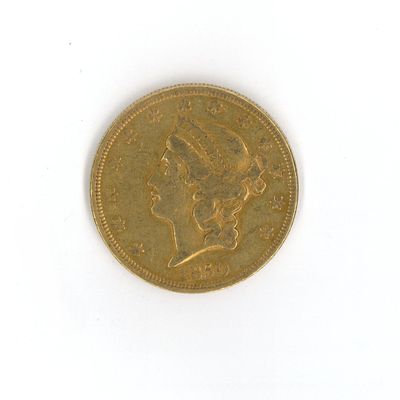 une vieille pièce d'or sur laquelle est représentée la tête d'une femme