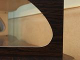a small microwave sitting on top of a wooden table