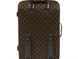 an image of a louis vuitton suitcase on wheels