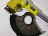 a yellow drill and a black tool on a table