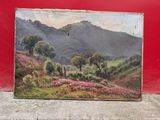 an oil painting of a mountain scene on a red wall