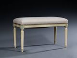 an upholstered bench with a beige upholstered seat