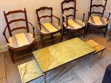 five chairs and a table in a room