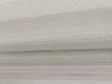 white sheets of paper stacked on top of each other on a table