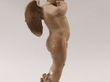 an image of a small statue of a boy holding a shield