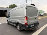 a silver van that is parked on the side of the road