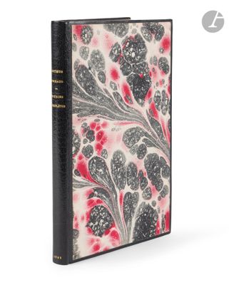 a black and white book with red flowers on it