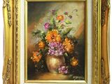 peinture d'un vase de fleurs dans un cadre doré sur fond blanc