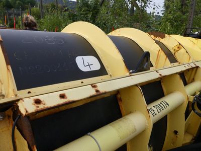 a close up of a large yellow machine with a number on it ' s side