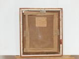 an old wooden box with a piece of paper on top of it
