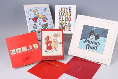 several christmas cards are arranged in a row on a table