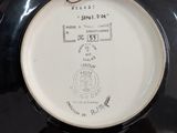 a black and white plate with a drawing on it
