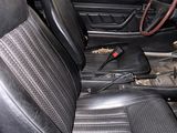 an image of the inside of a car with black leather seats