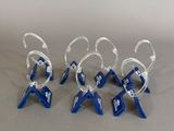six blue and white wine glasses are lined up on a gray surface