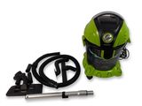 the vacuum is green and black with a hose and power cord