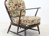 an image of a chair with a floral upholstered seat