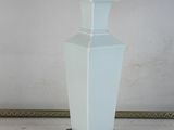 a table lamp with a fringe on top of it