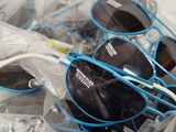 several pairs of sunglasses are wrapped in plastic bags and ready to be shipped