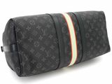 louis vuittou toilet bag in black monogram canvas with red, white, and yellow stripes