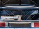 an open trunk of a car with a bunch of items in it