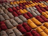 several pairs of slippers are lined up on a table