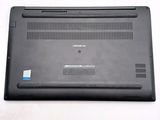 the back of a laptop with a black cover on a white surface