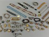 many different types of jewelry on the table