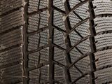 a close up of a tire on a stand on a table