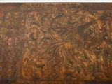 a large wooden box with a bird on it