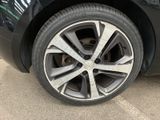 a close up of a tire on a black car