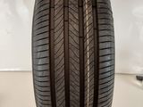 a close up of a tire on a white surface