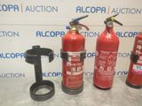 three fire extinguisors are lined up on a table