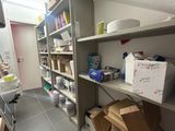 a room with a lot of boxes and boxes on the shelves