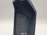 a bottle of motor oil sitting on top of a table
