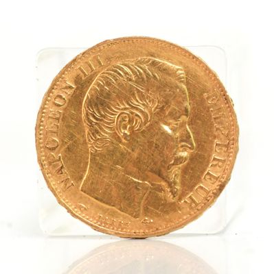 l'image d'une pièce d'or sur laquelle figure le visage d'un homme