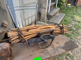 a cart full of sticks sitting on a table outside