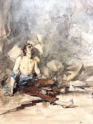une image représentant un homme assis par terre