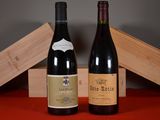 two bottles of wine sitting next to each other on a table