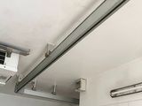 a ceiling mounted air conditioner in a garage