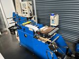 a blue machine that is sitting in a room