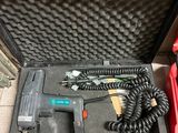 a tool in a case with a cord in it