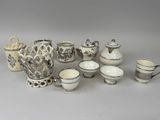 a lot of cups and saucers on the table